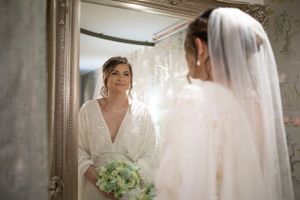 Bride looking in mirror