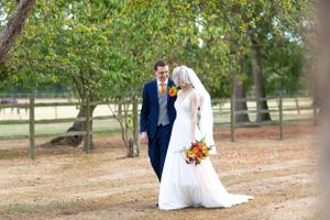 Bride and groom walking holding hands