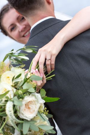 bride hugging her new husband