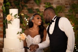 bride and groom cutting their wedding cake