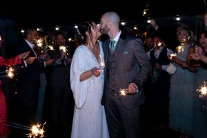 Bride and groom with sparklers on wedding day