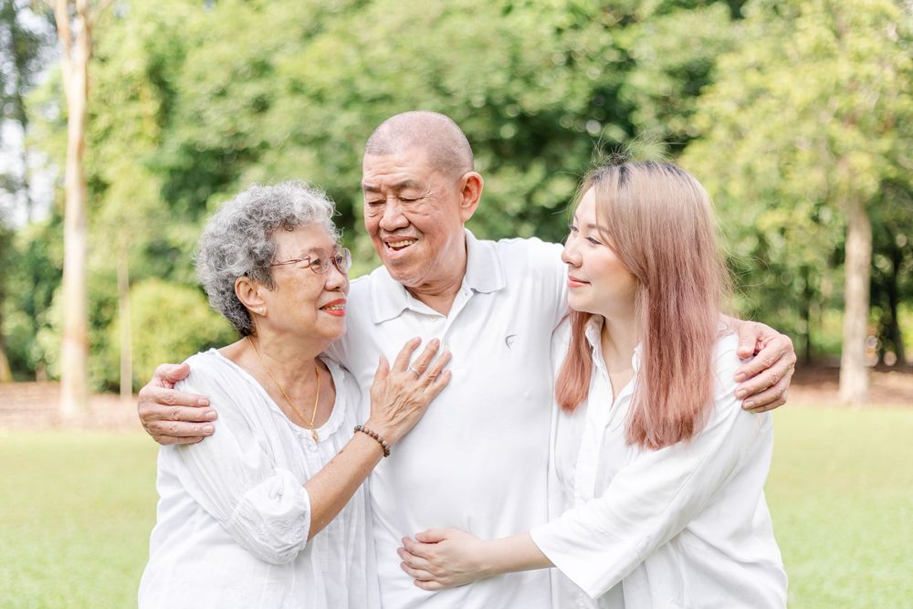 elderly parent and daughter in a family photo at botanic gardens