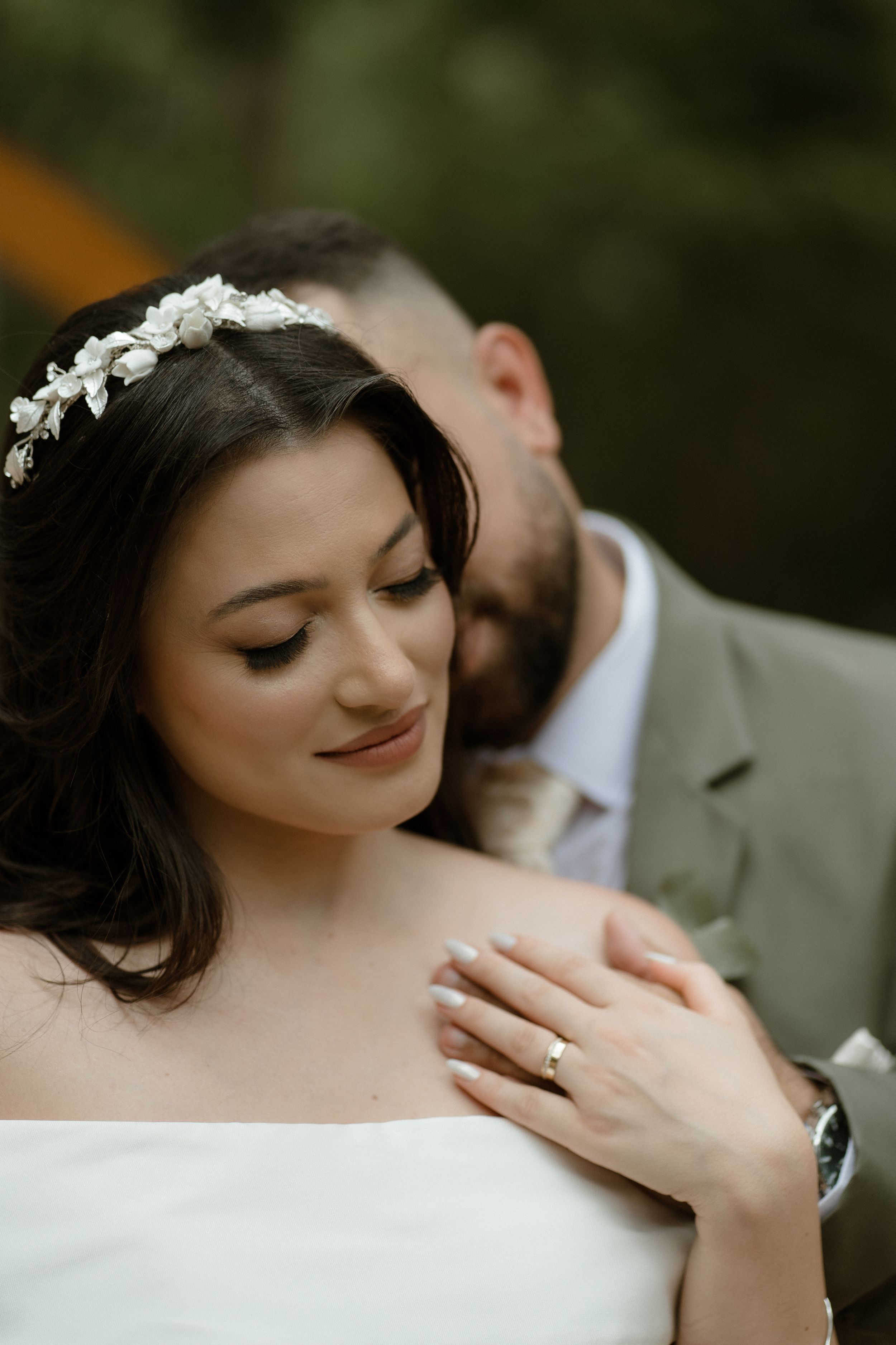 Intimate close-up of couple during romantic wedding moment.