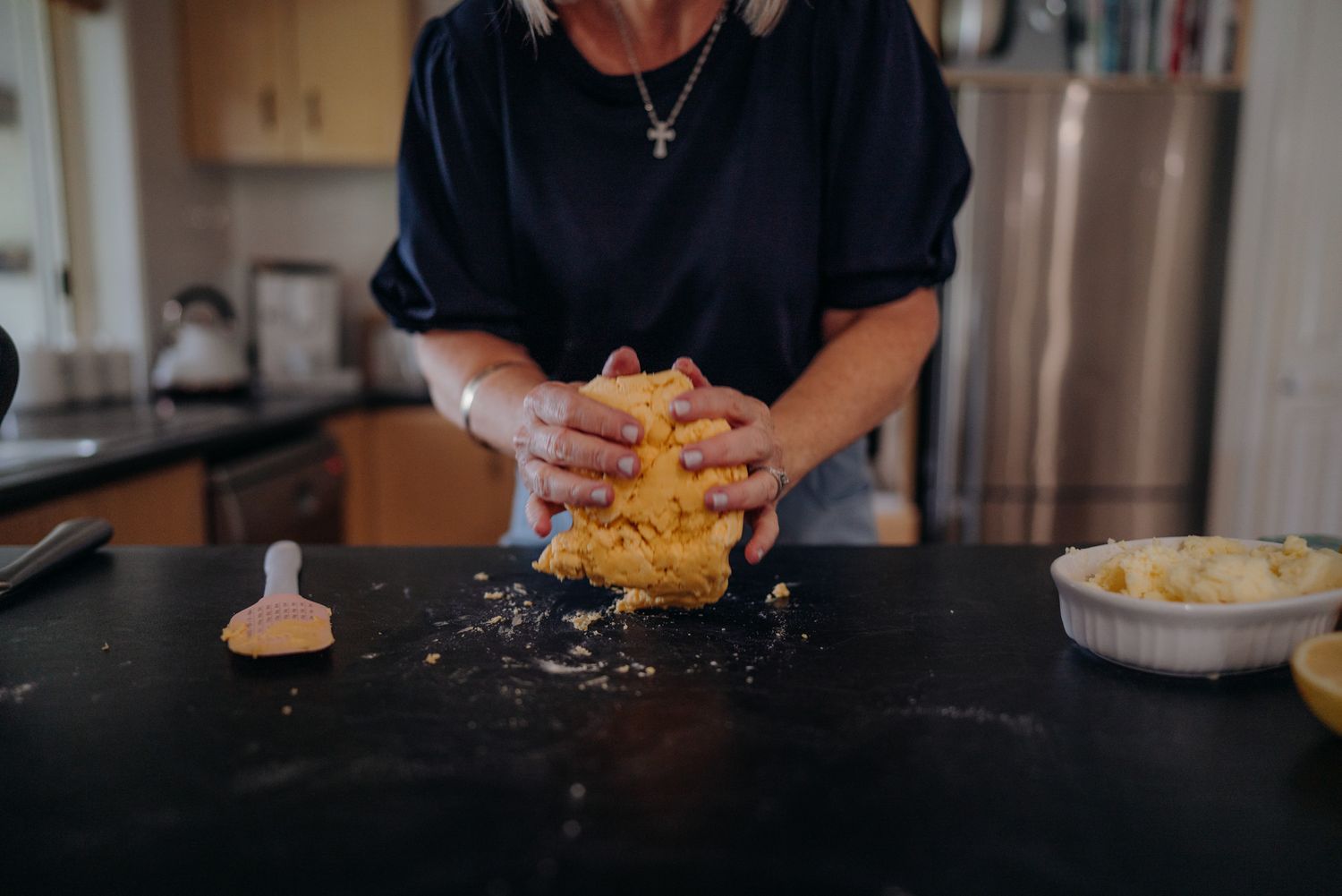 woman kneading shortbread dough