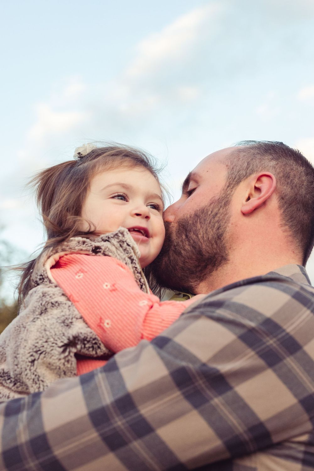 Precious moment of father and child outdoors by Abby Gleason Photography