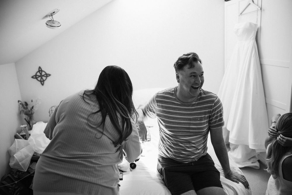 Emery's loved ones smile as everyone gets ready the morning of the wedding