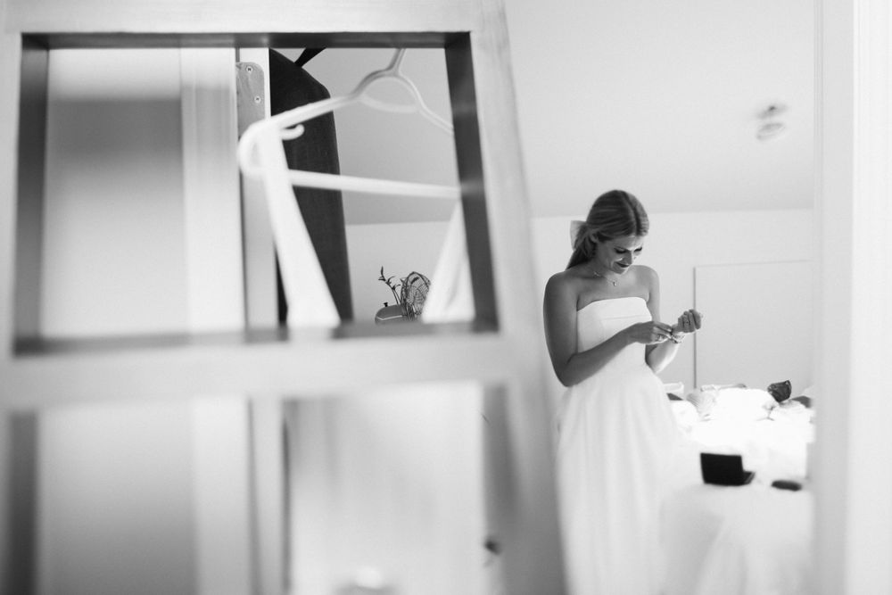 Emery puts on a bracelet on the morning of her wedding in Victoria, BC