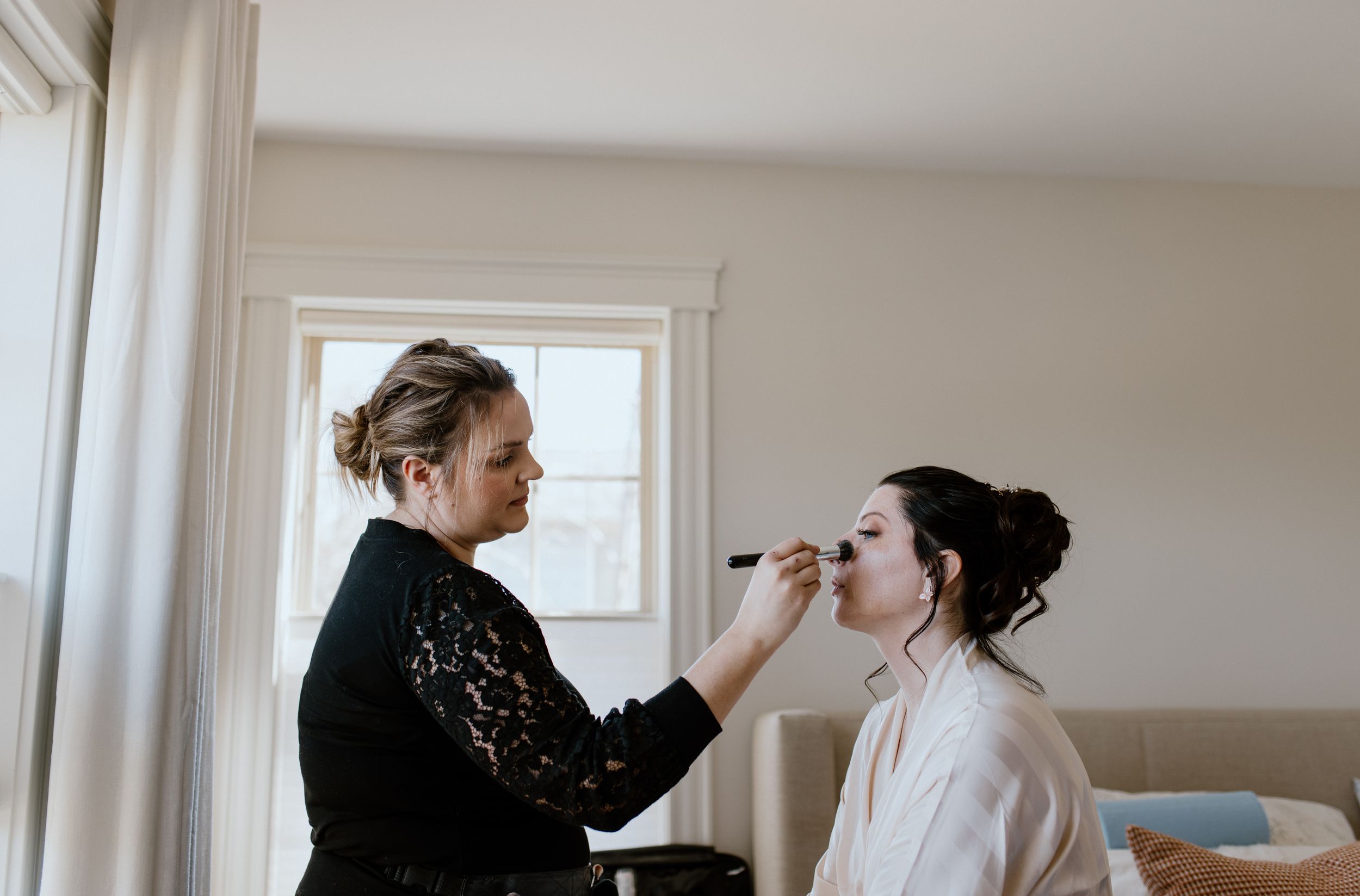 MUA Janine Gerrits doing makeup for bride, Amber-Lyne, in Halifax, Nova Scotia