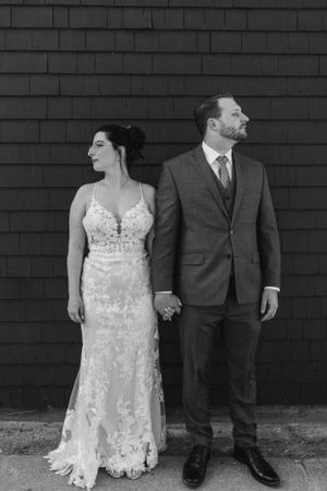 Black and white bride and groom portraits along the Halifax Waterfront by The Lower Deck in Halifax, Nova Scotia