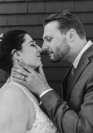 Black and white bride and groom portraits along the Halifax Waterfront by The Lower Deck in Halifax, Nova Scotia