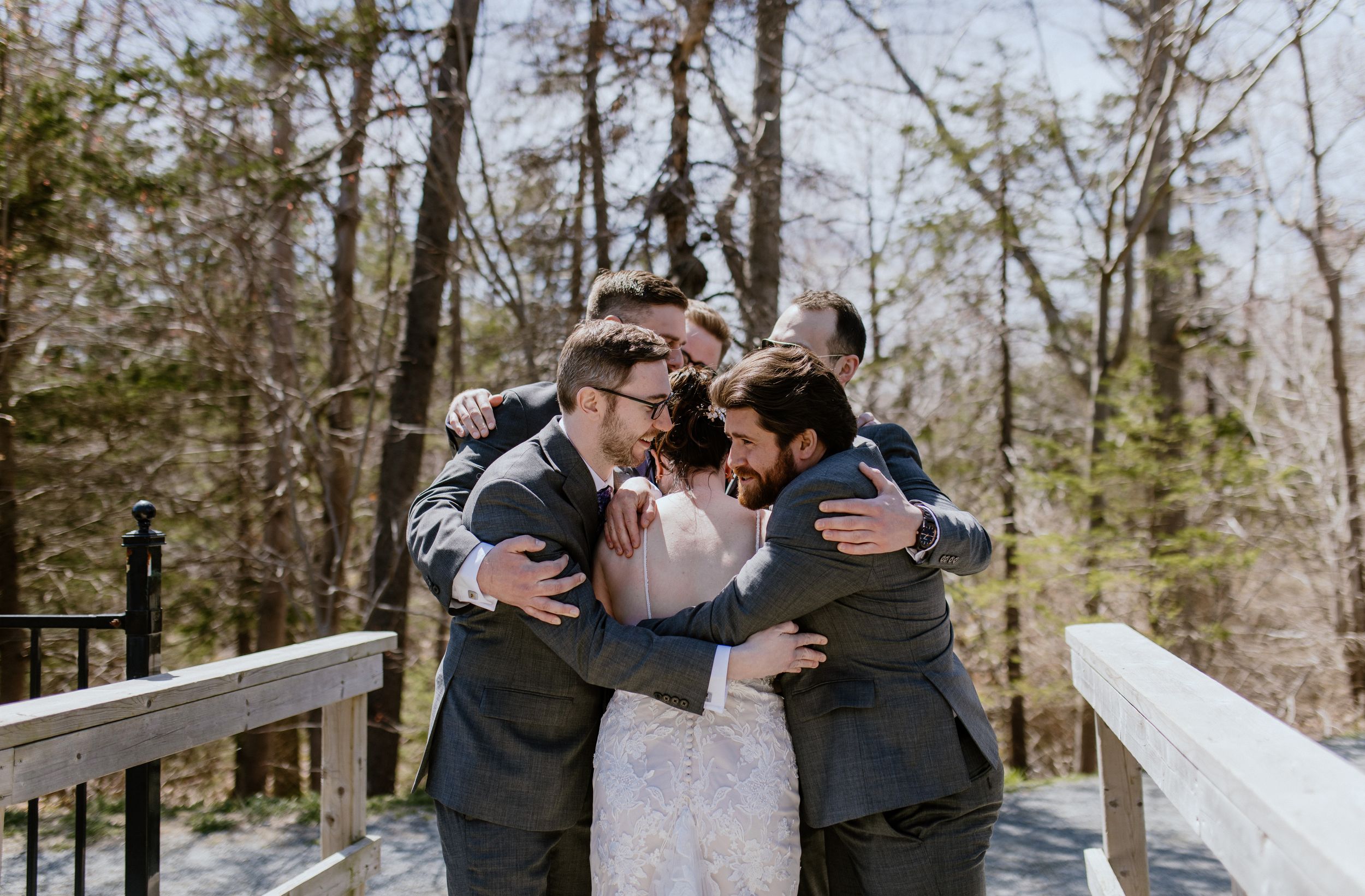 Bride does first look with groomsmen at Shubie Park in Dartmouth, Nova Scotia