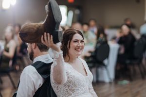 A joyful couple dances at their wedding reception on the dance floor.