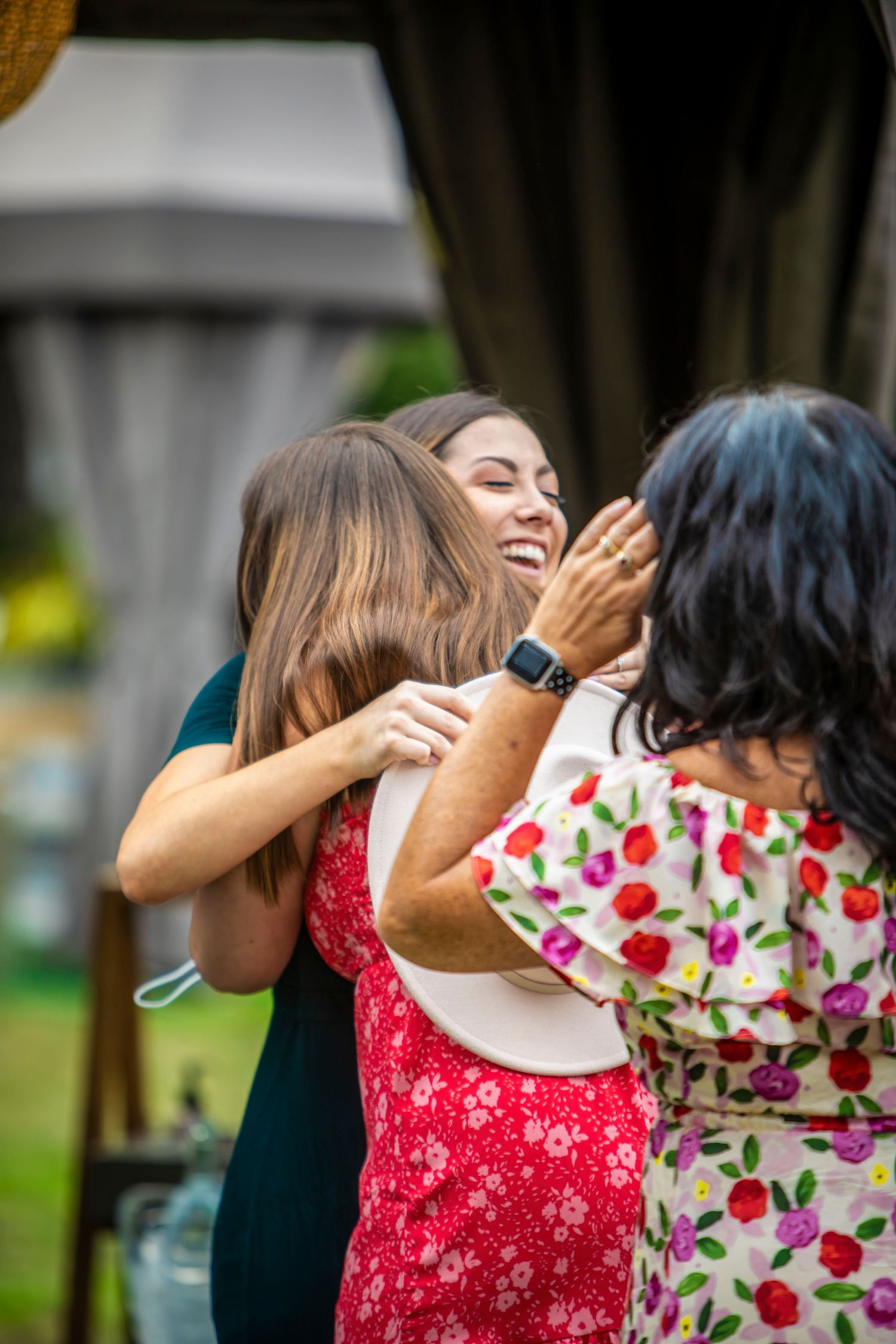 a mother hugging her daughter after a wedding proposal