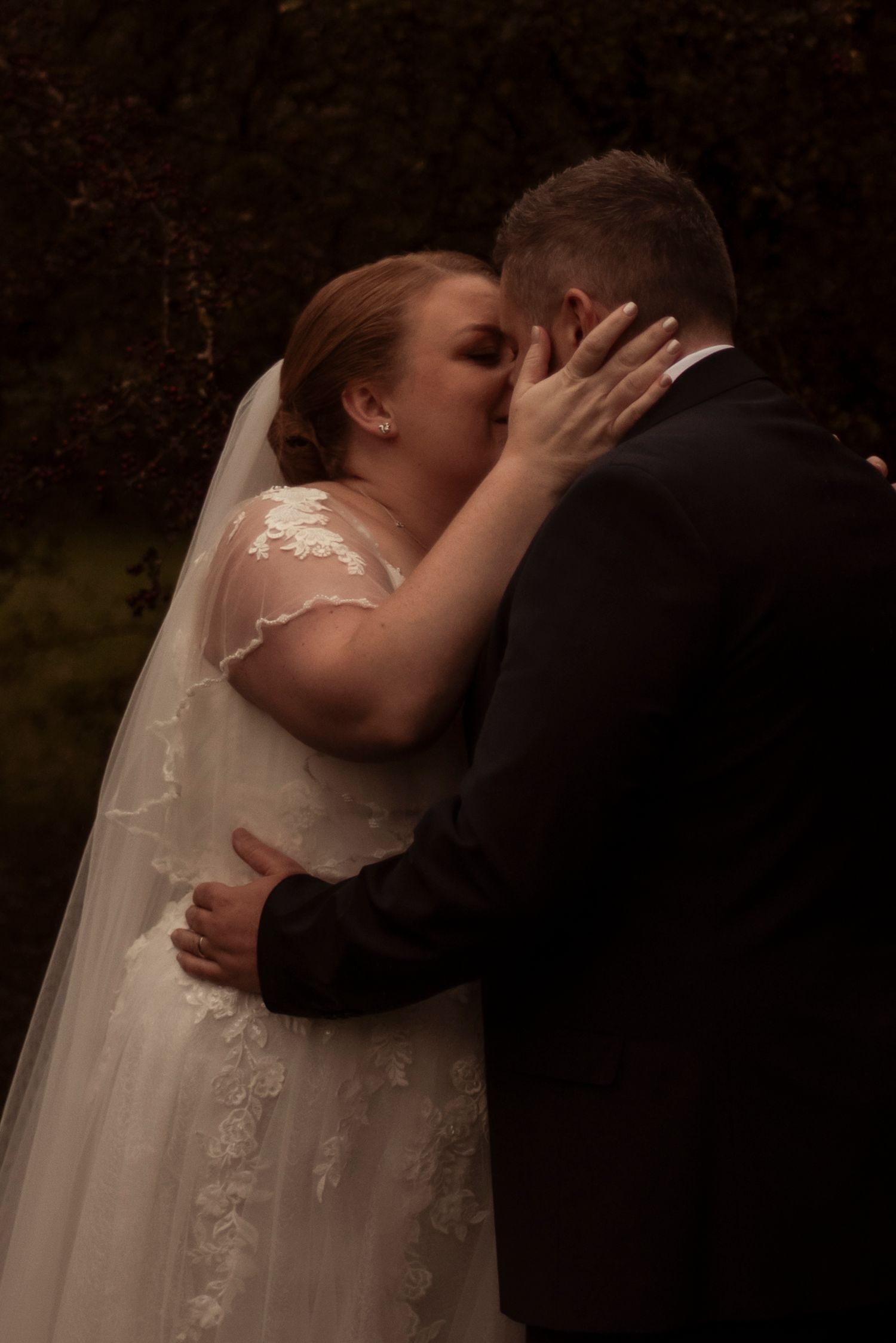 Wedding day portrait, bride kissing groom, sheffield wedding