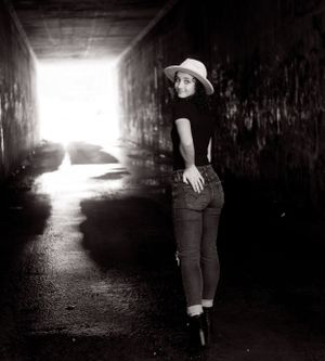 Black and white tunnel photos with silhouette and bright light at end creating dramatic contrast.