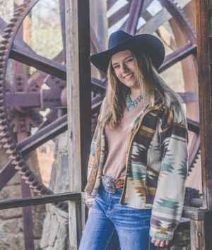 Casual western fashion photography featuring denim and southwestern patterns.