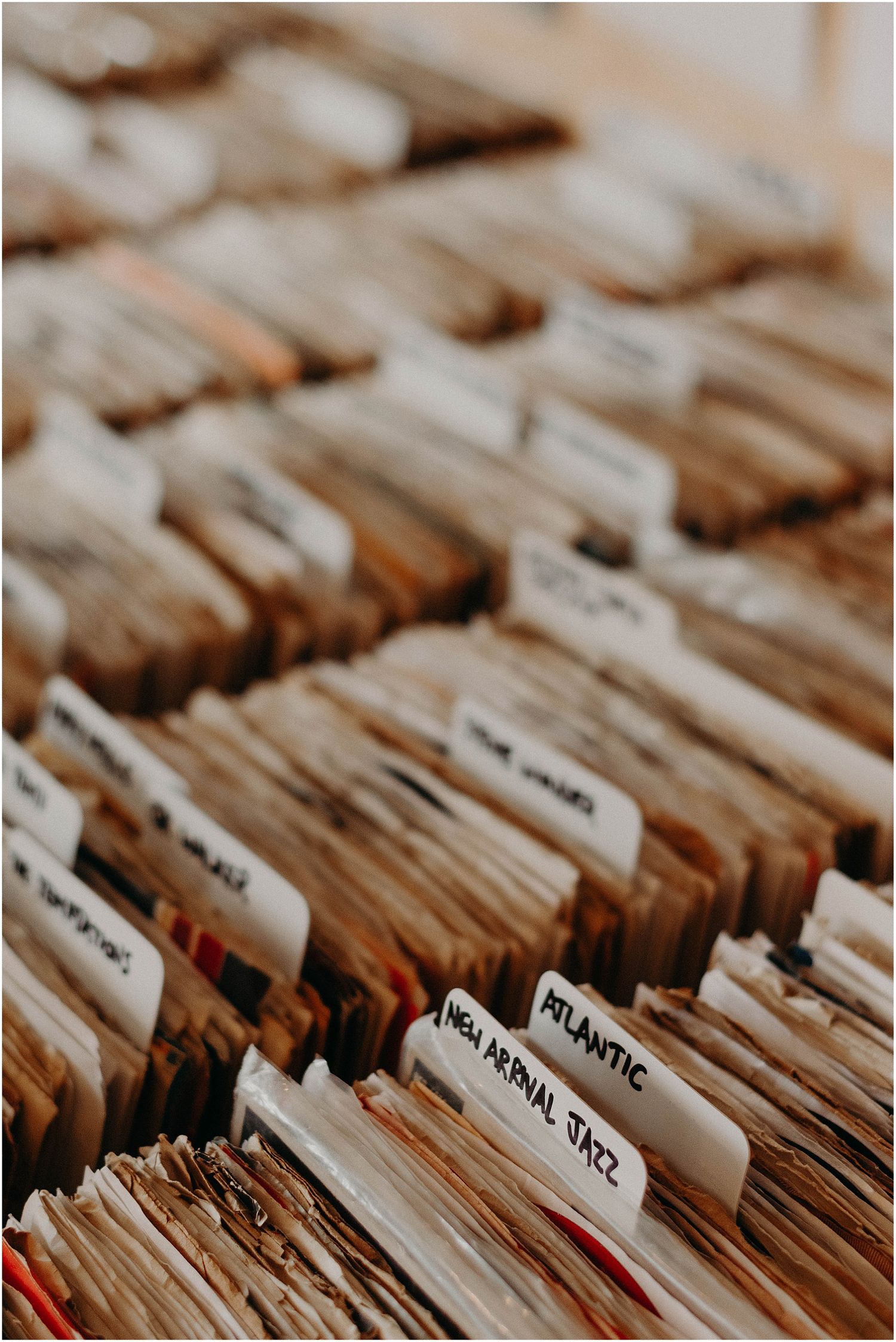 Organized vinyl record collection with divider cards sorting different music categories.