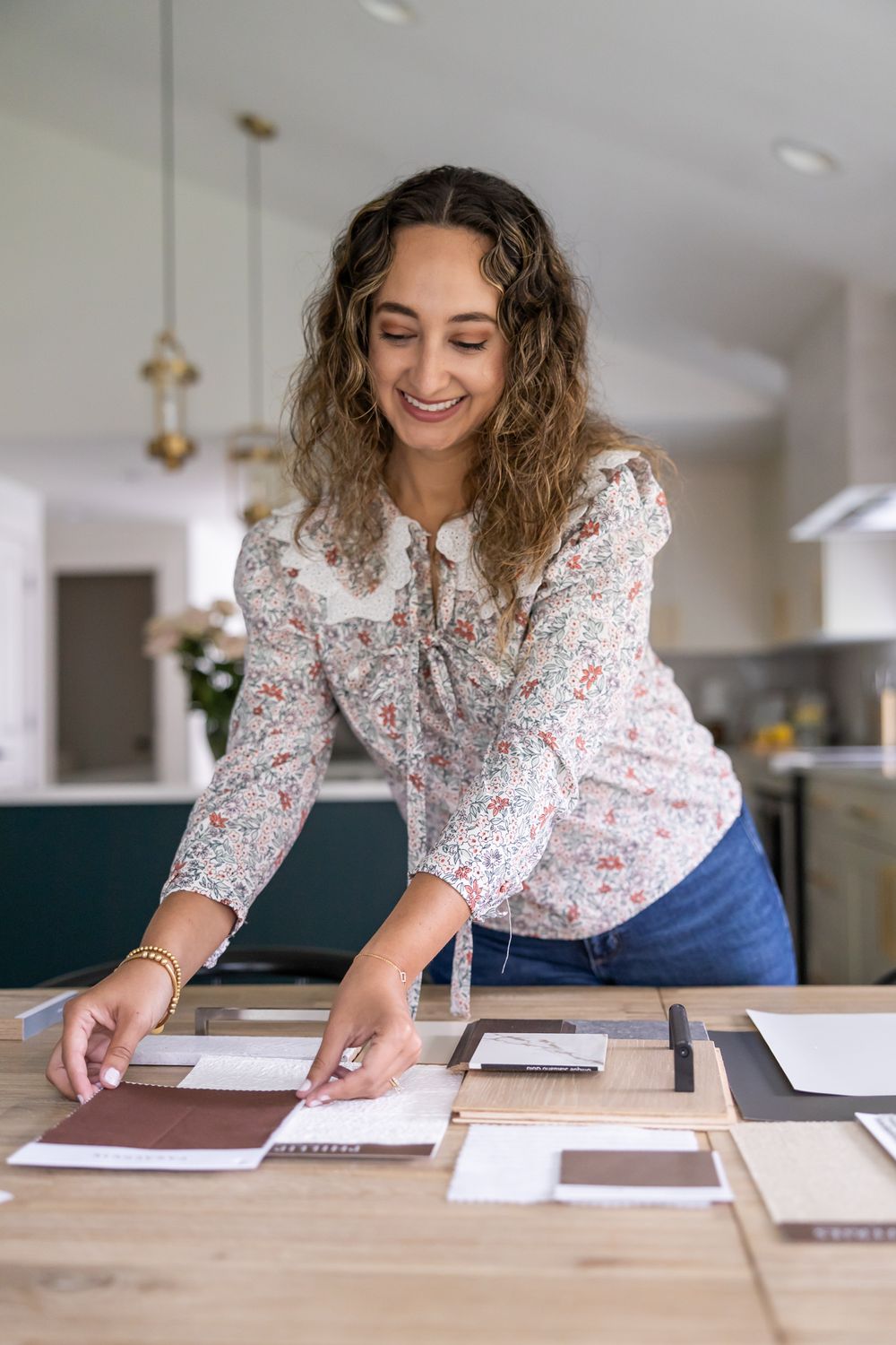 Fairspring Designs an Interior Designer in Maple Valley, WA lifestyle personal branding photos woman laying samples down