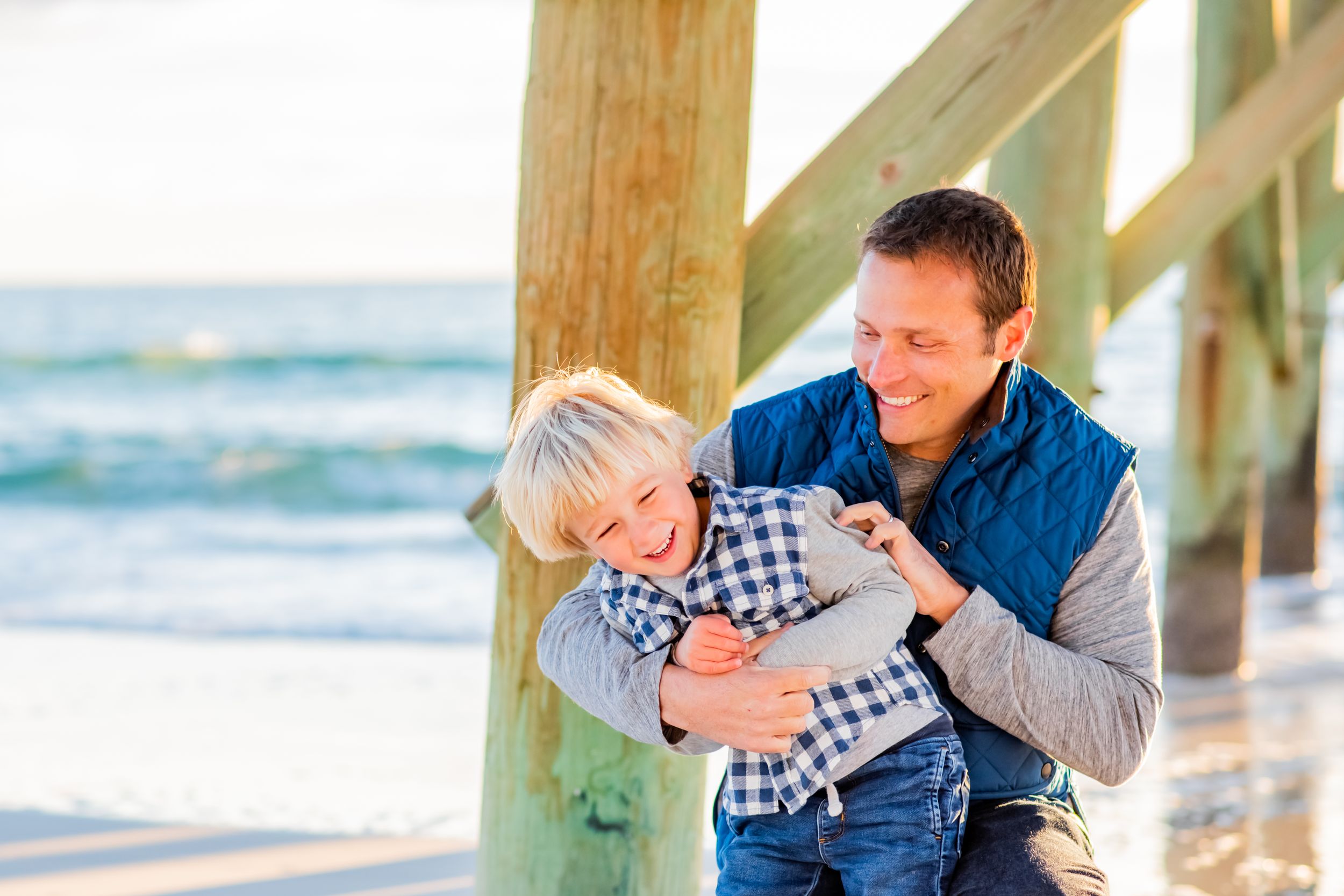 Dad & son playing on the beach Panama City Florida