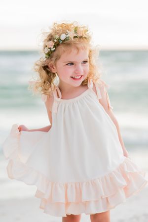 cute little girl twirling on the beach in Panama City Beach Florida