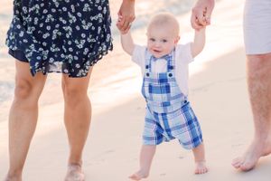 toddler walking on Panama City Beach Florida at sunset
