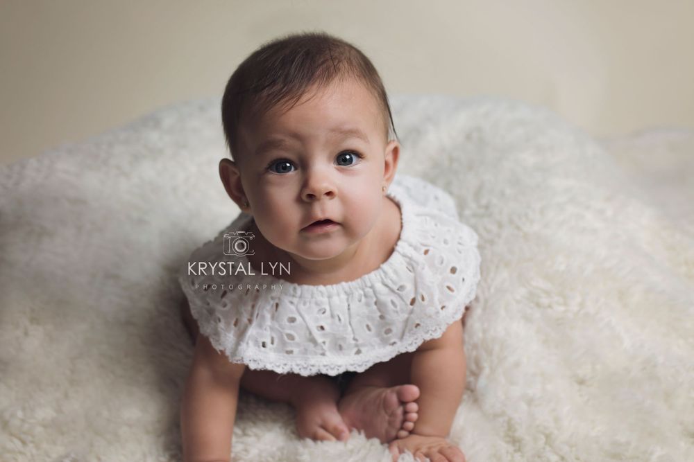 Dressed in white for her sitter session