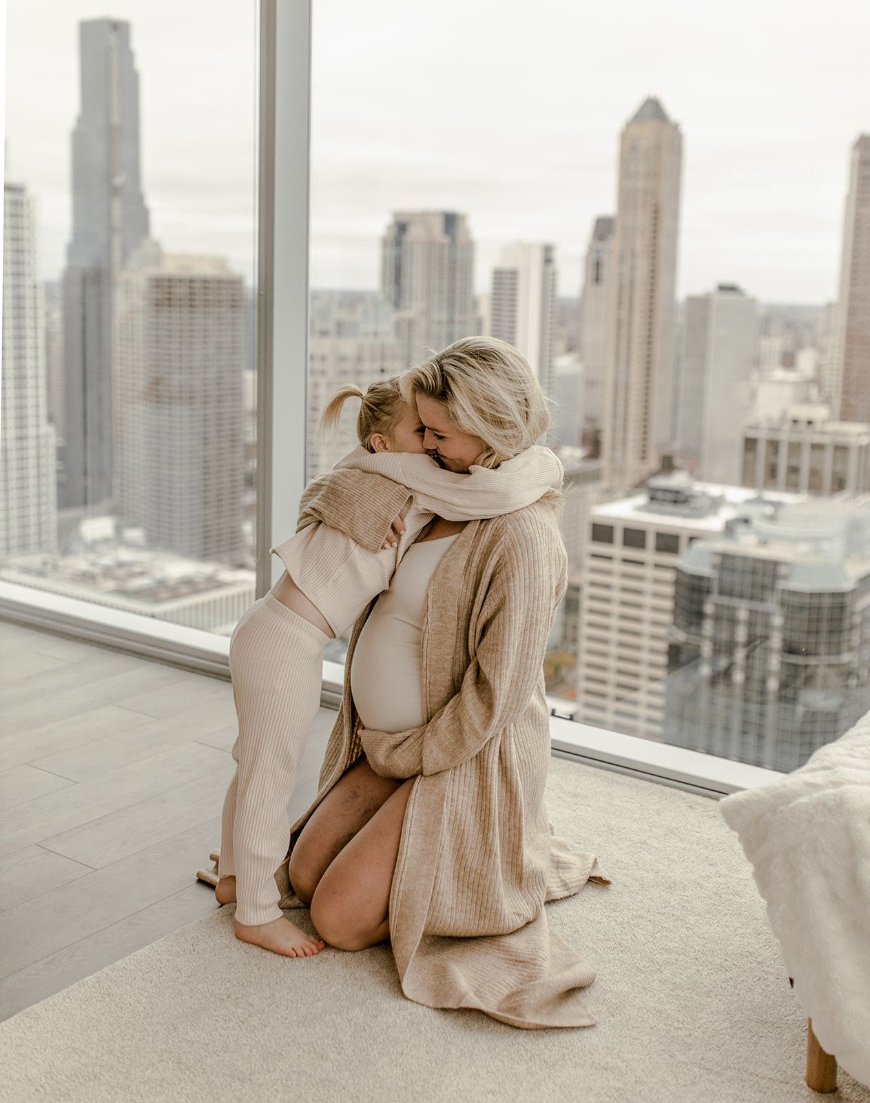 Tender embrace captured against Chicago's dramatic skyline background.