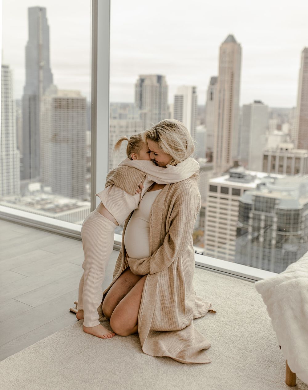 Tender embrace captured against Chicago's dramatic skyline background.