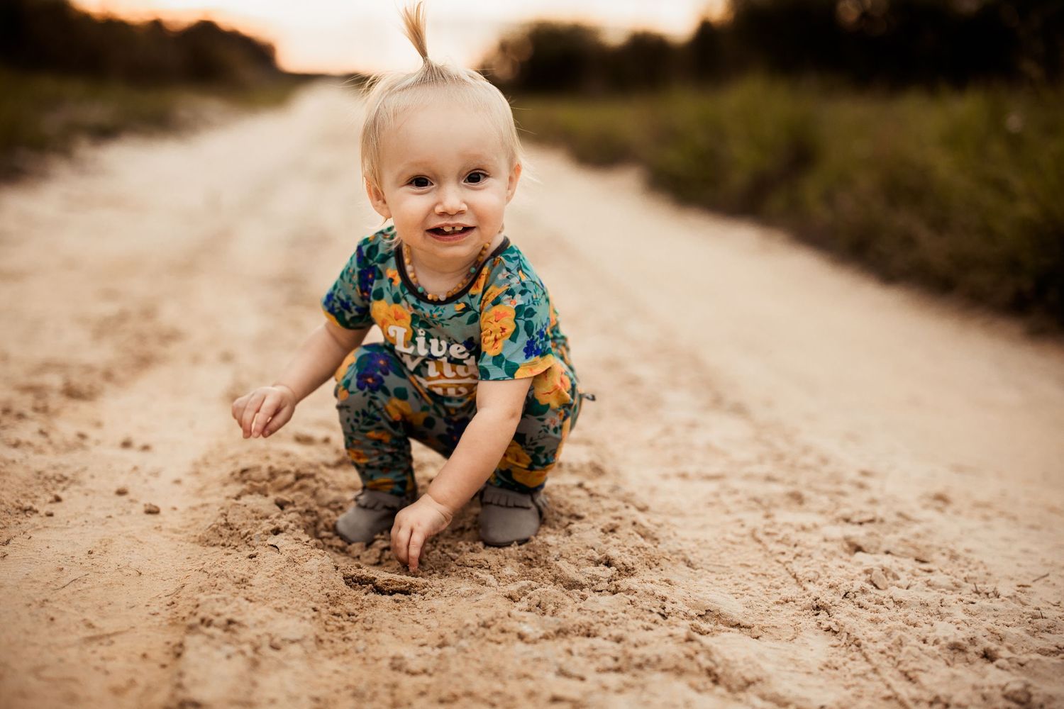 Lakeland Photographer- Baby posing on dirt road