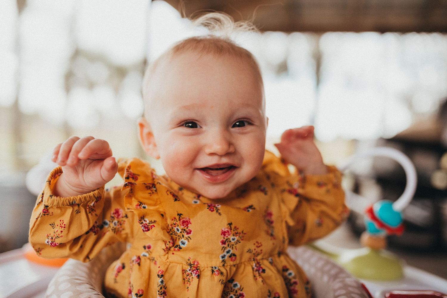 Lakeland Newborn photographer- Baby smiling on a porch