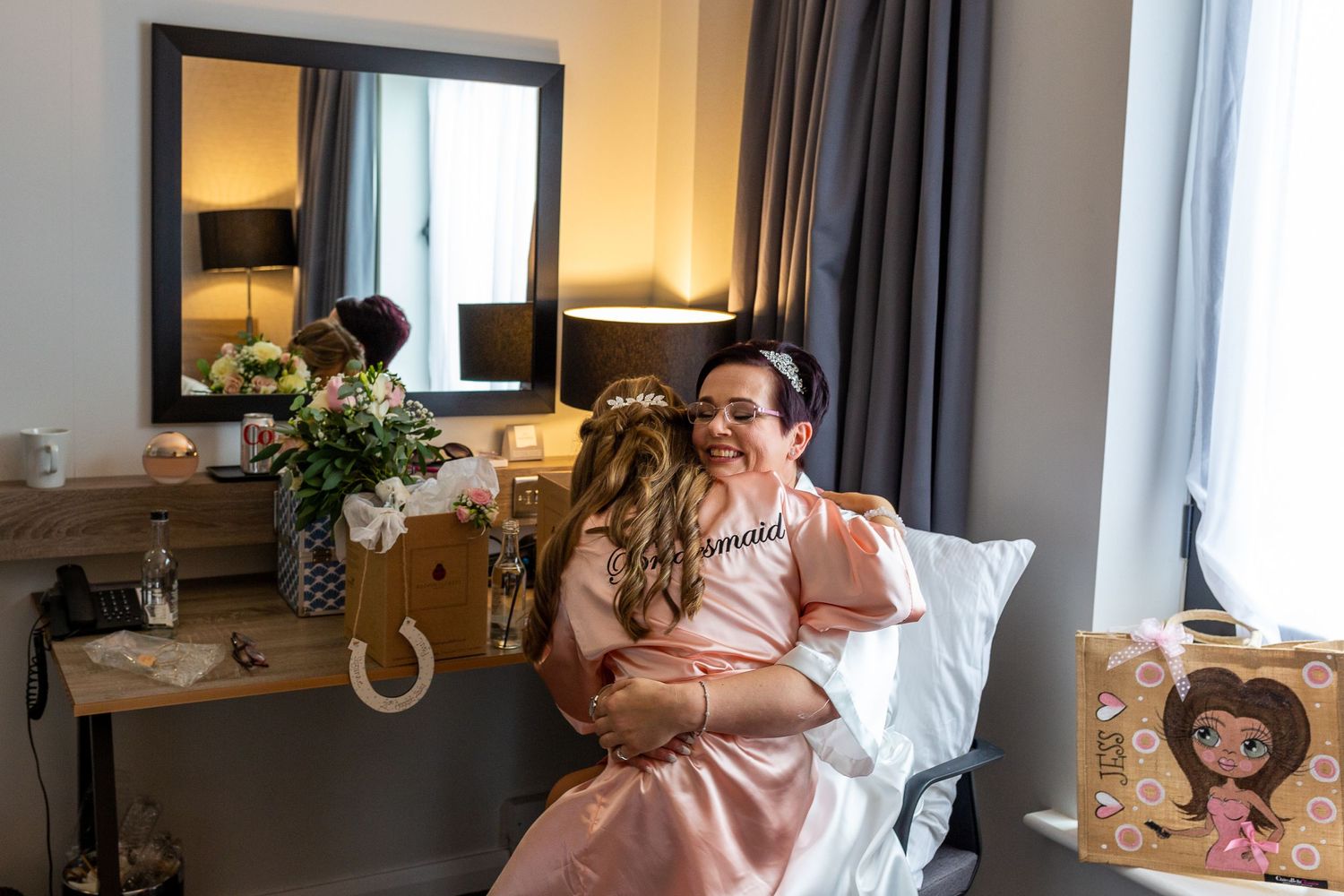Bride gets a hug from her daughter on the wedding morning. and Liverpool wedding photographer. Stuart Morris Photography