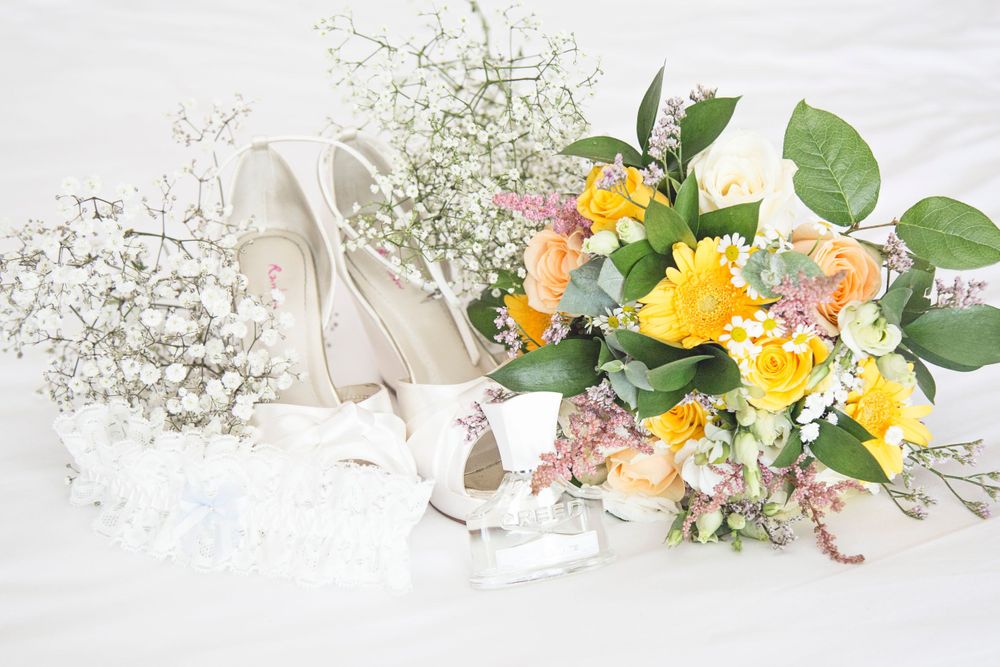 Bridal bouqet and wedding shoes photo