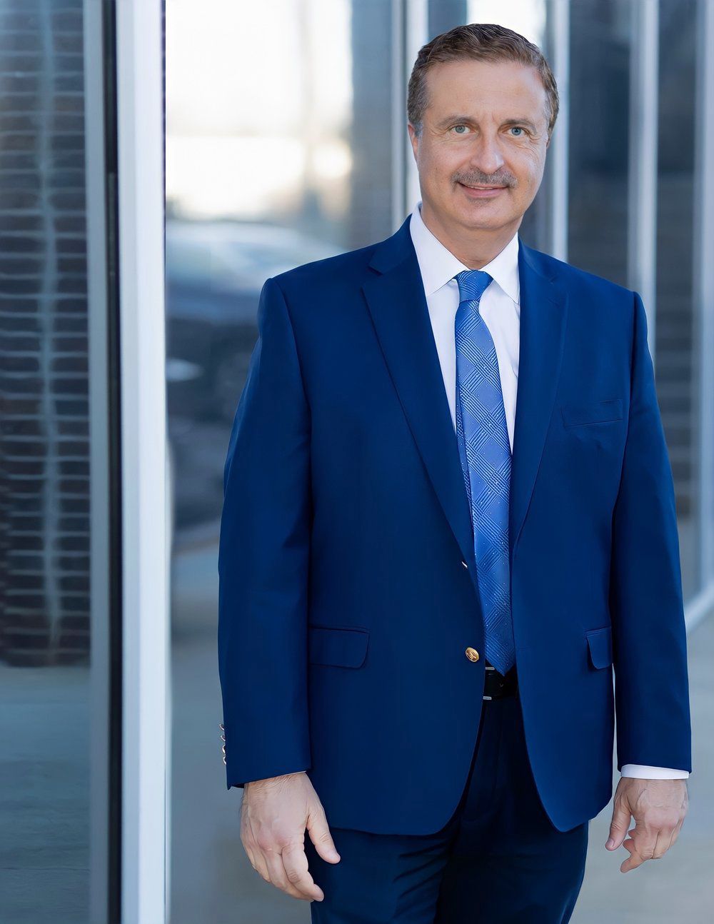 Man portrait professional looking middle age man blue suite blue tie gray hair mustaches. branding photography by alexandra shay photography