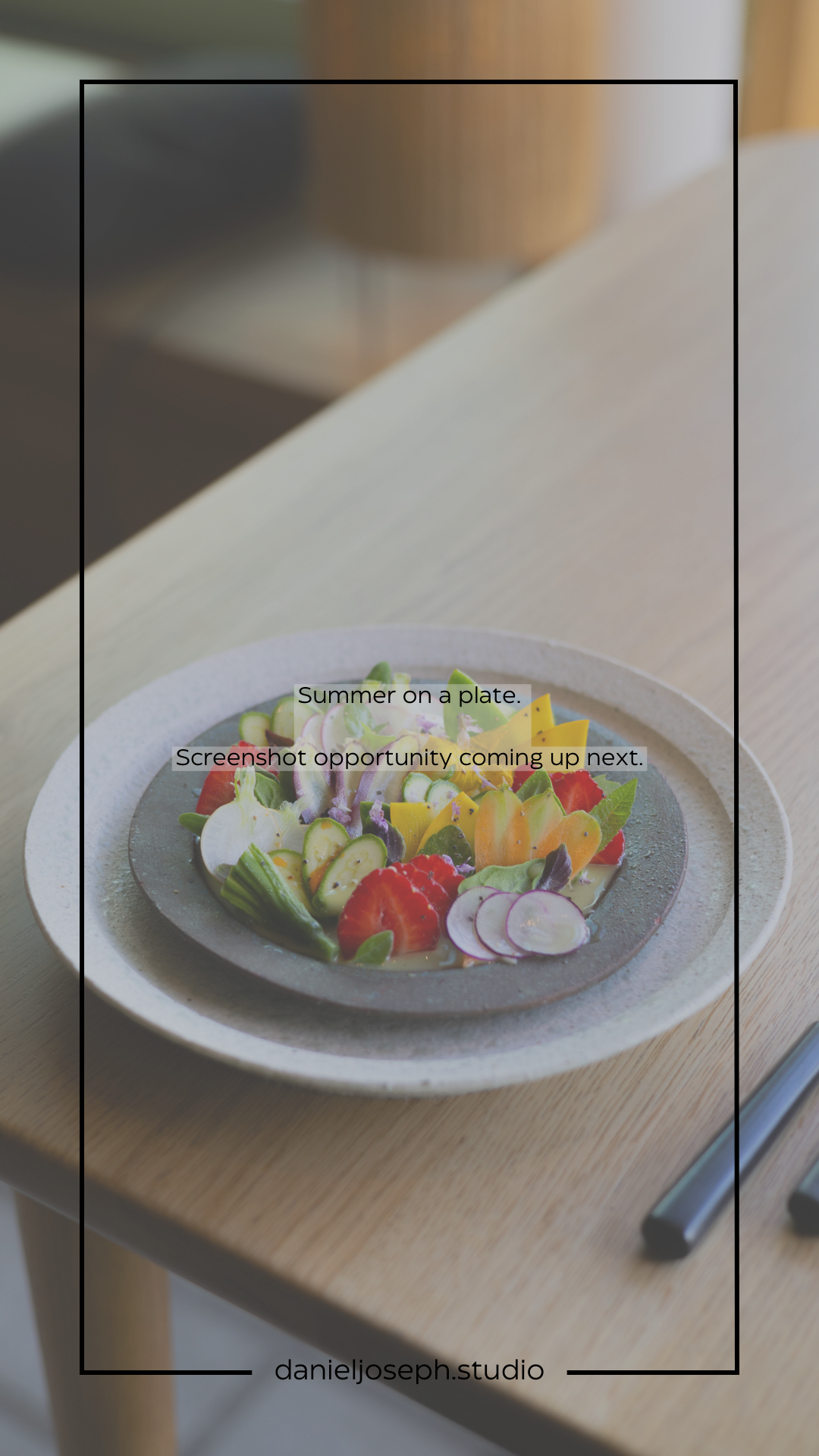 Fresh salad with colorful vegetables and radishes arranged artfully on a grey ceramic plate.