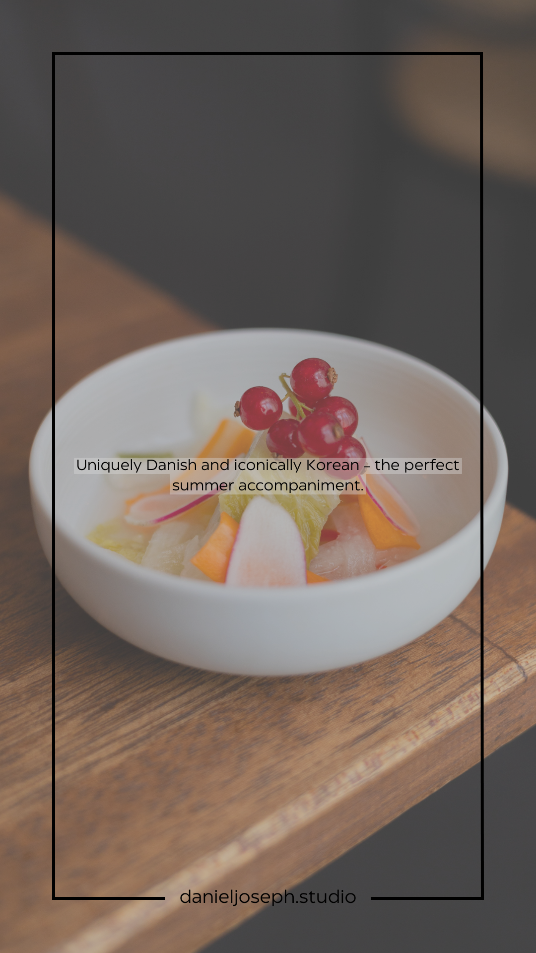 A delicate dish combining fresh fruits and berries with red currants in a white ceramic bowl.