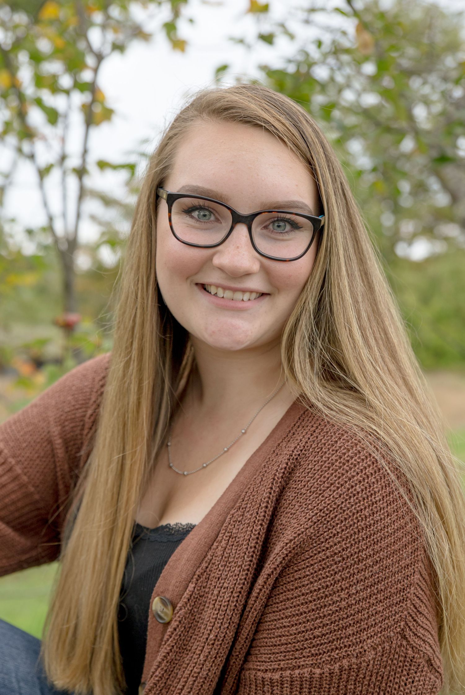 Pittsfield Middle High School senior pictures outside  in the orchard.