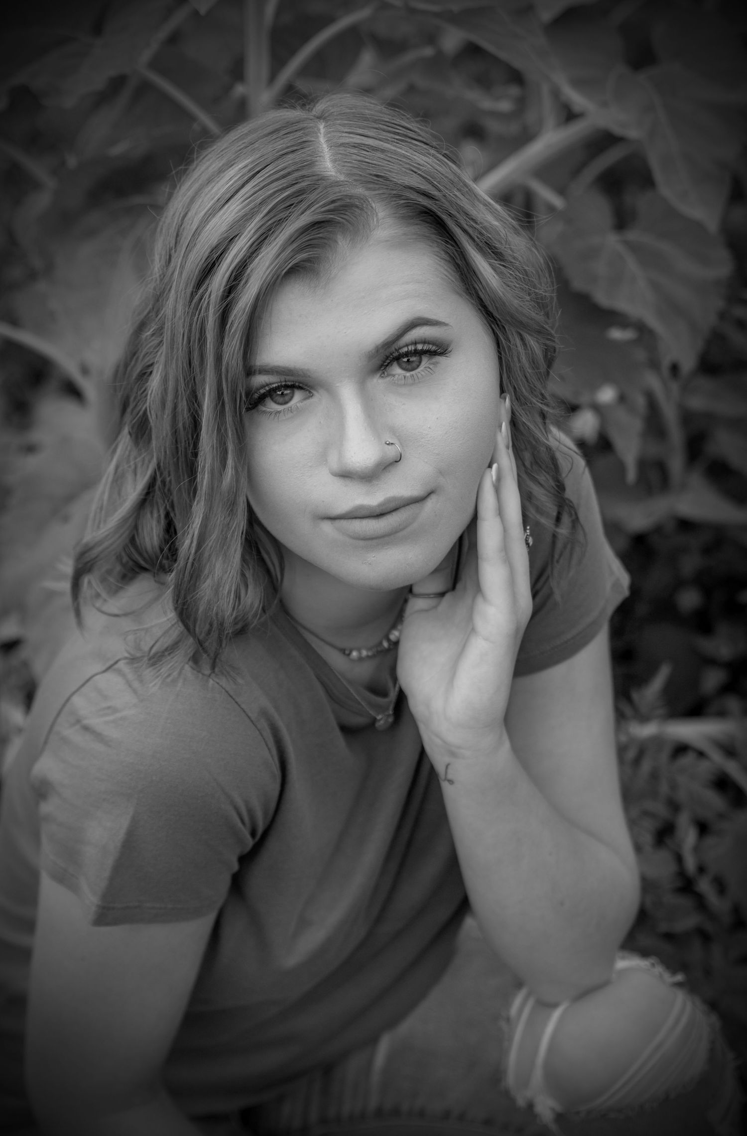NH High school senior posing for her senior portrait. Black and white in Barnstead studio