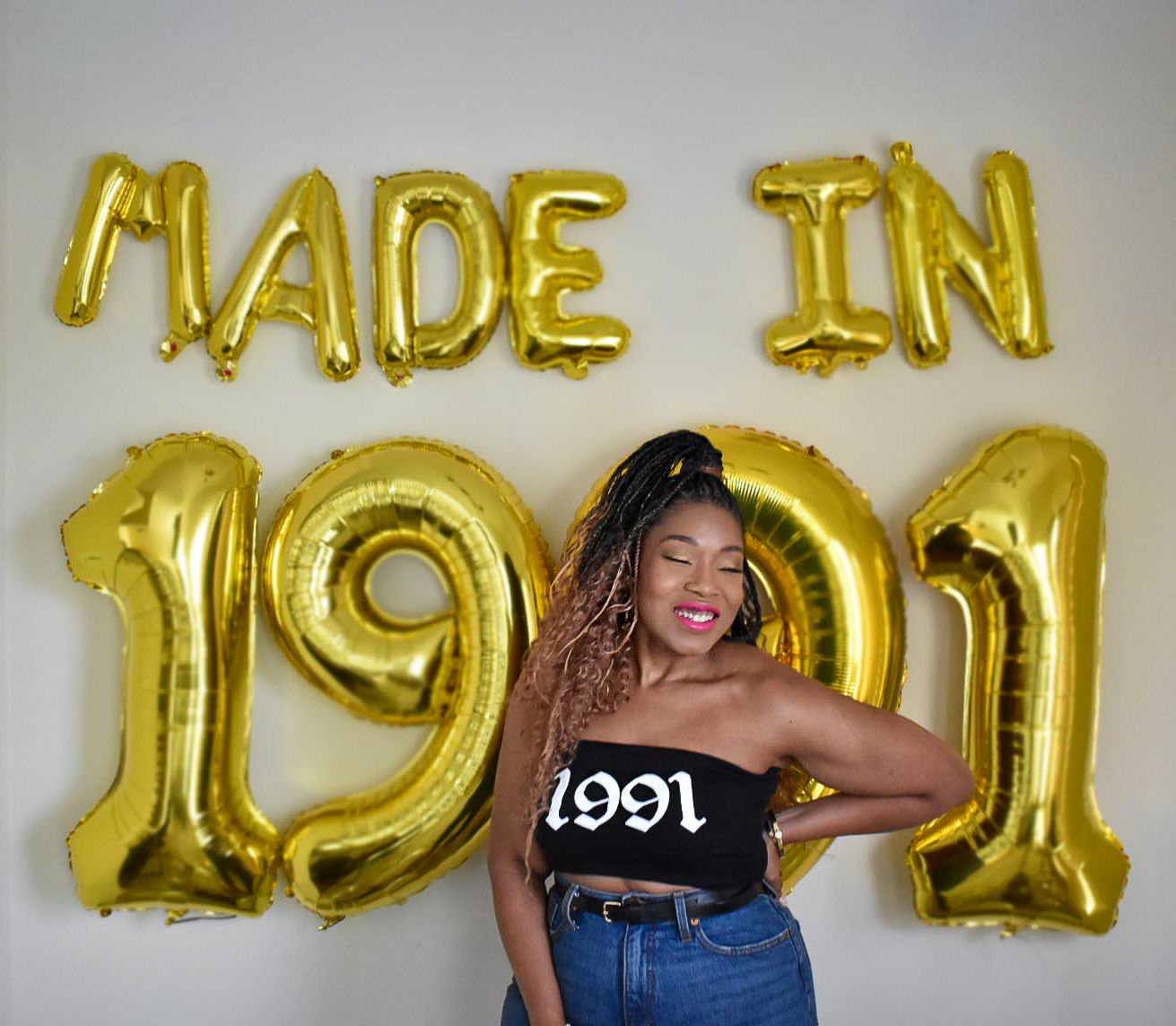 Gold balloon letters spelling 'MADE IN 1991' against a light background.
