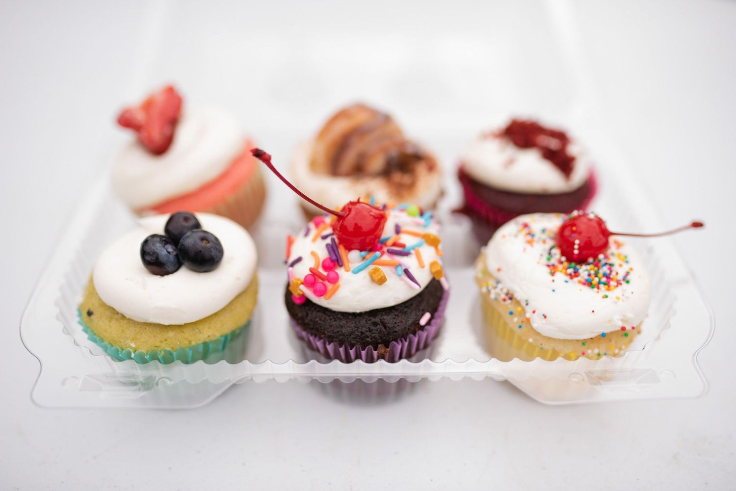 assortment of cupcakes from curbside cakery at nw guilford farmers & specialty market