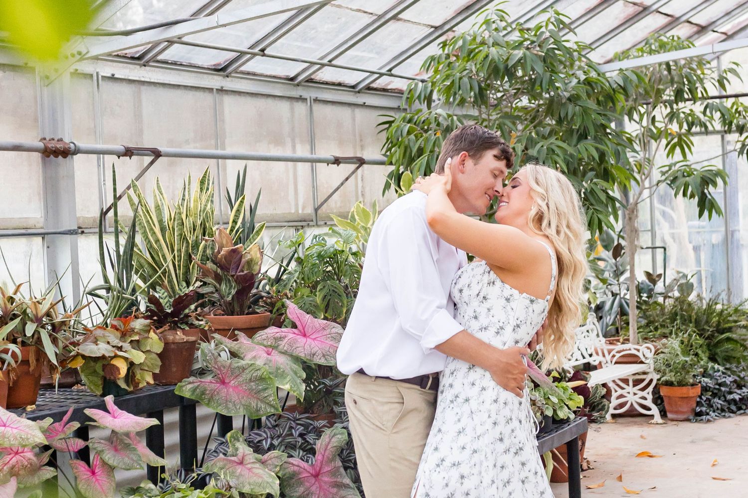 man and woman in greenhouse at burden museum and gardens
