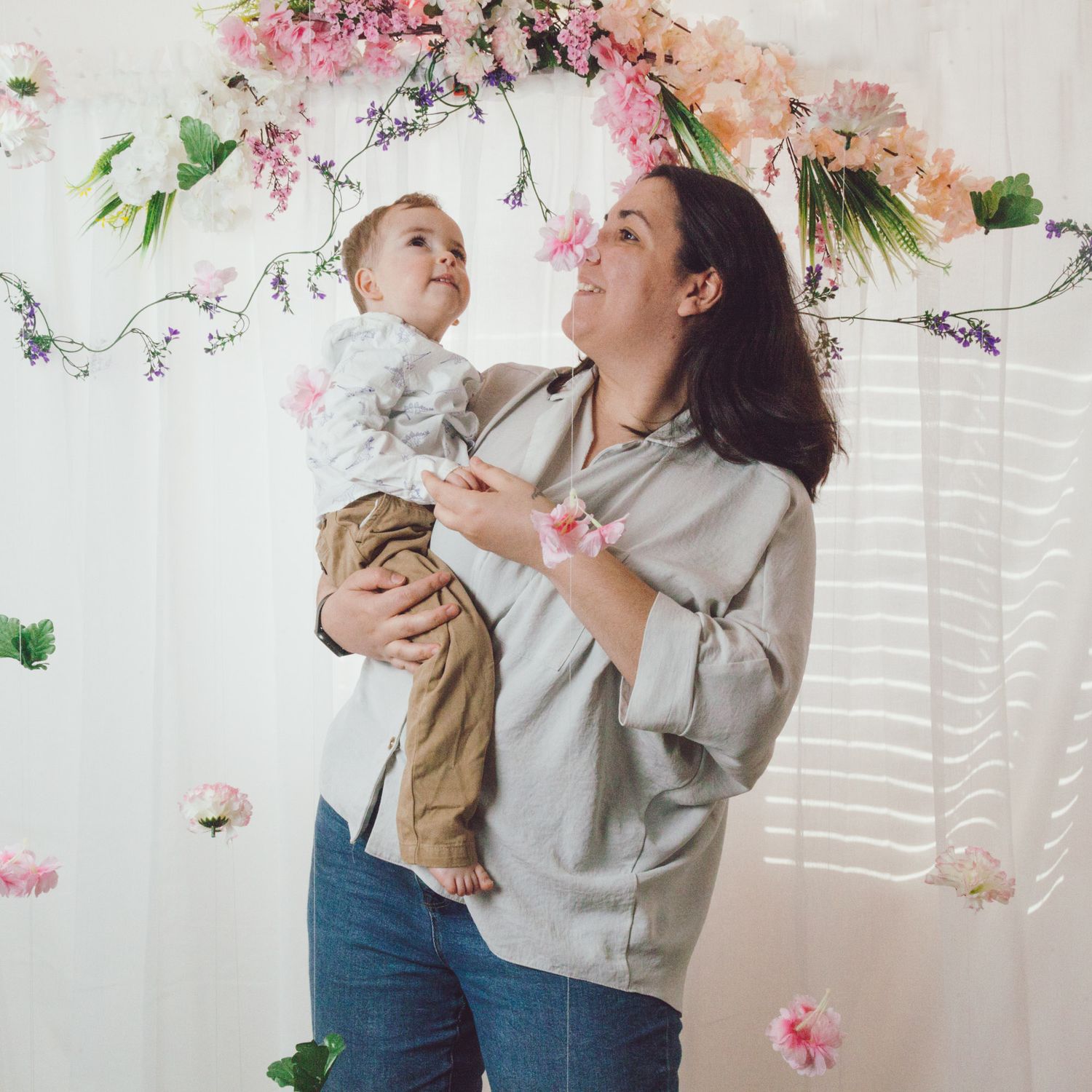 Mother and son watching the backdrop flower, captured by Maria Photography, a family photographer in Gosport.