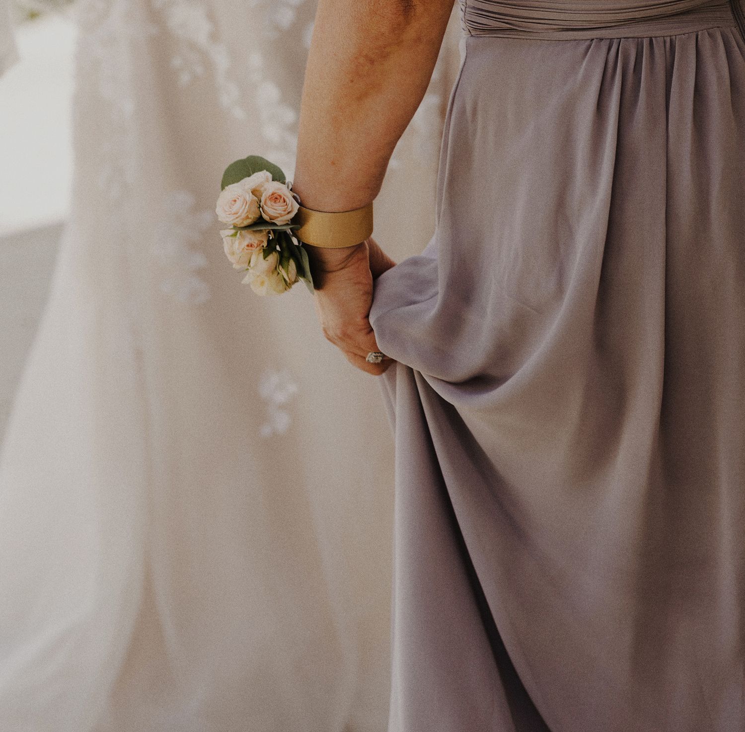 E Noelle Photography in-home wedding in Hidden Hills Los Angeles, mother's orange, pink, and white floral boutonniere