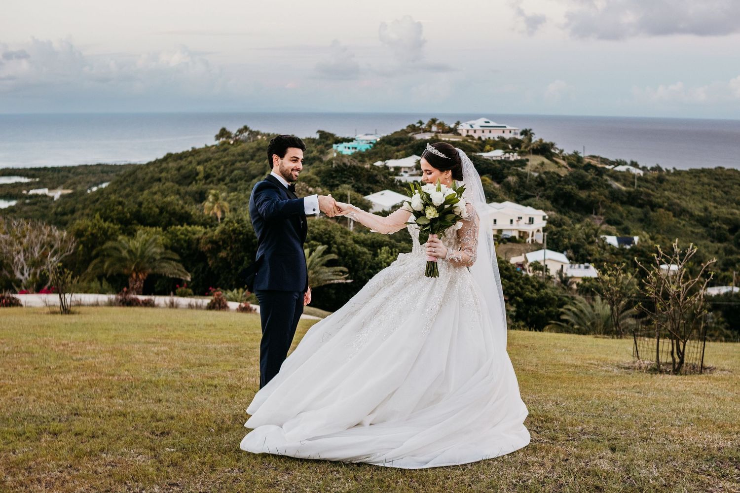 Wedding ceremony setup overlooking a beautiful coastal landscape.