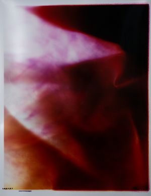 Abstract red and burgundy tones creating a moody atmospheric gradient effect.