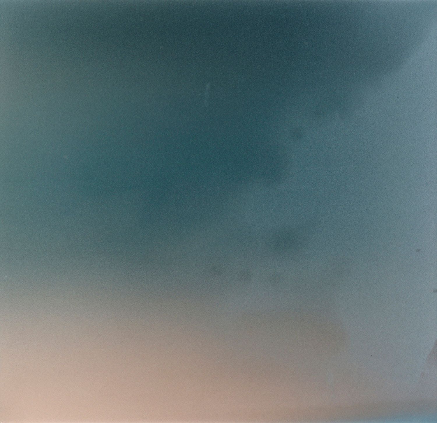 Teal and gray gradient creating a moody atmospheric effect in horizontal composition.