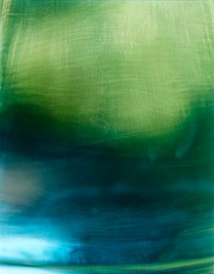 Artistic green and turquoise watercolor gradient with soft blending effects.