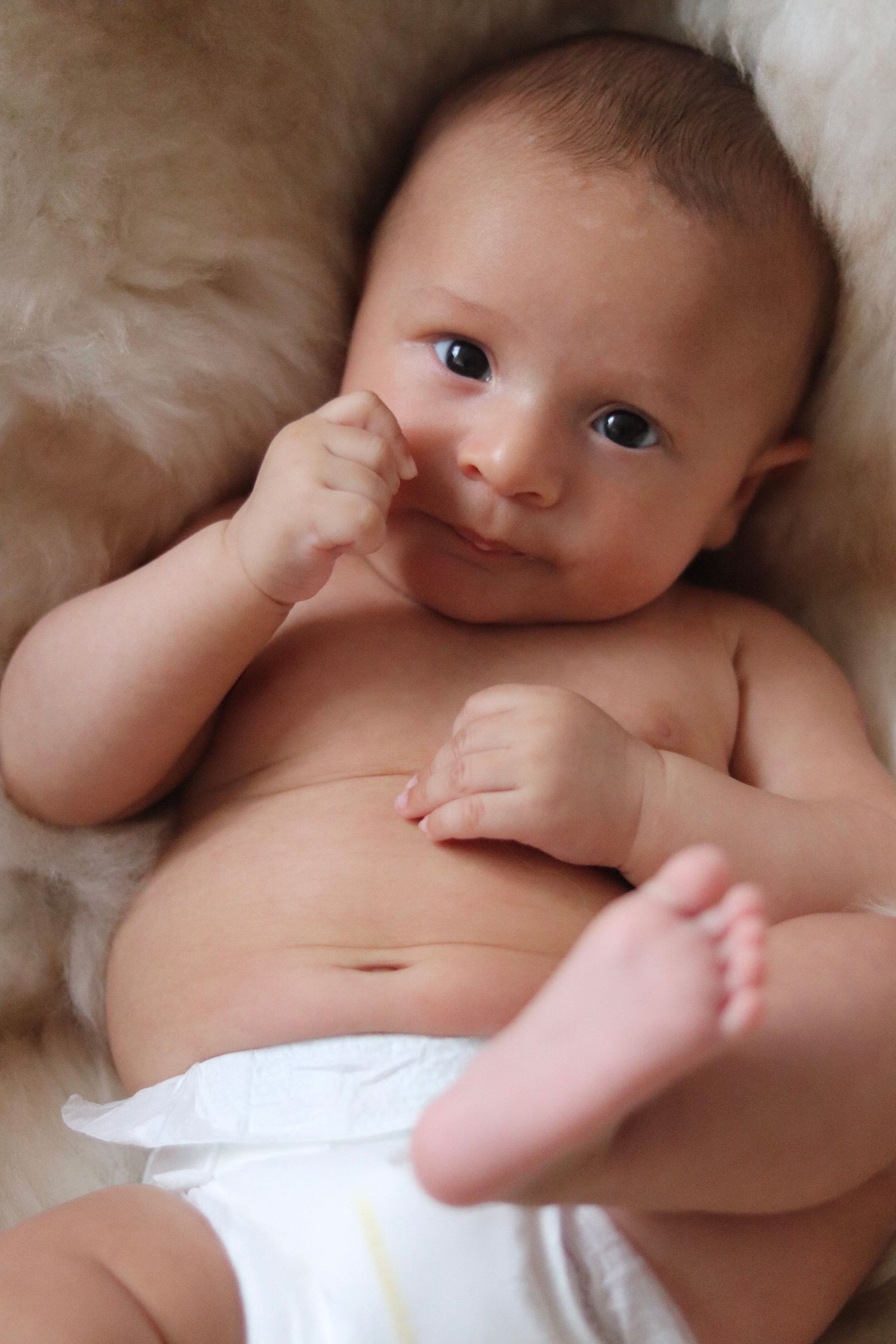 Cute baby in nappy posing in Wallington, Surrey