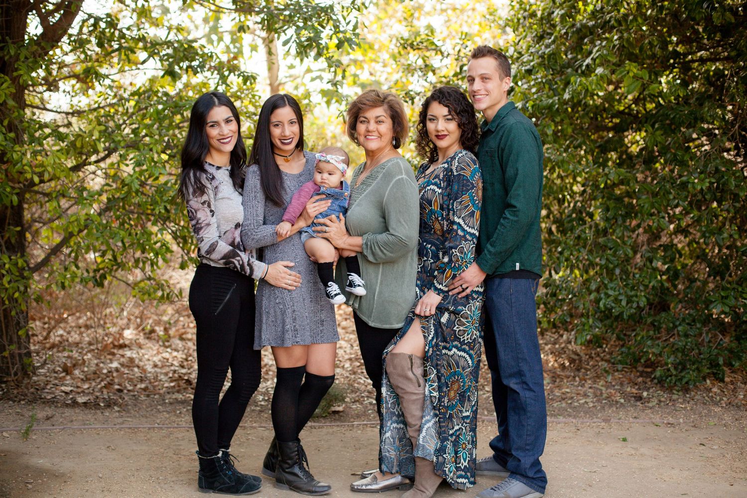 Generational family photography of grandmother with daughters their spouses and grandkid in Southern California