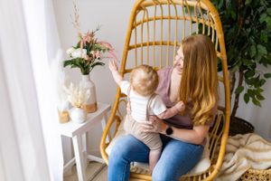 Cozy moment in rattan hanging chair with white side table and potted plants.
Janesville, WI
Brodhead, WI