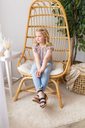 A rattan hanging chair with cushion sits by indoor plants in a cozy corner with cream decor accents.
Janesville, WI
Brodhead, WI